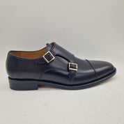 Hebillas en piel negra de la marca Schuhkonzept, dos hebillas con acabado elegante y diseño clásico para accesorios.