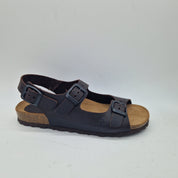 Sandalias Interbios de dos hebillas y trasera en color marrón, con suela de moda y diseño cómodo para uso diario.