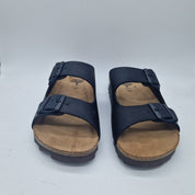 Sandalias negras de piel con dos hebillas de la marca INTERBIOS, ideales para un estilo cómodo y elegante.